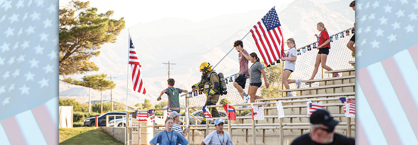 Photo of people in bleachers with firefighter